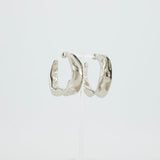 Alaïa Fluide Drop Hoop Earrings in Silver