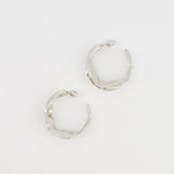 Alaïa Fluide Drop Hoop Earrings in Silver